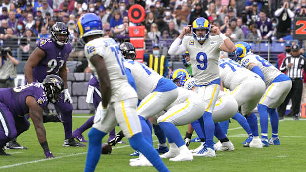 Jan 2, 2022; Baltimore, Maryland, USA; Los Angeles Rams quarterback Matthew Stafford (9) signals to wide receiver Van Jefferson (12) in the fourth quarter against the Baltimore Ravens at M&T Bank Stadium. Mandatory Credit: Mitch Stringer-USA TODAY Sports